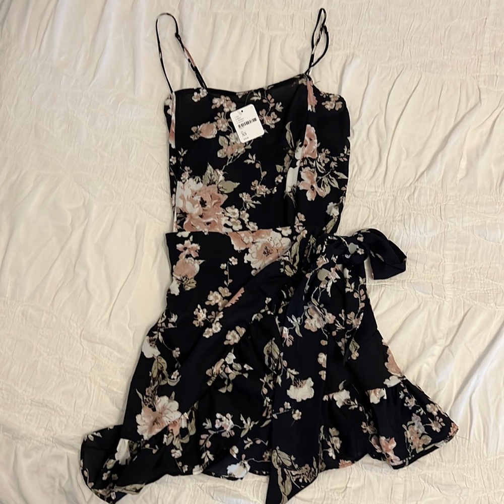 Free People never worn beautiful dress , wrap on the waist